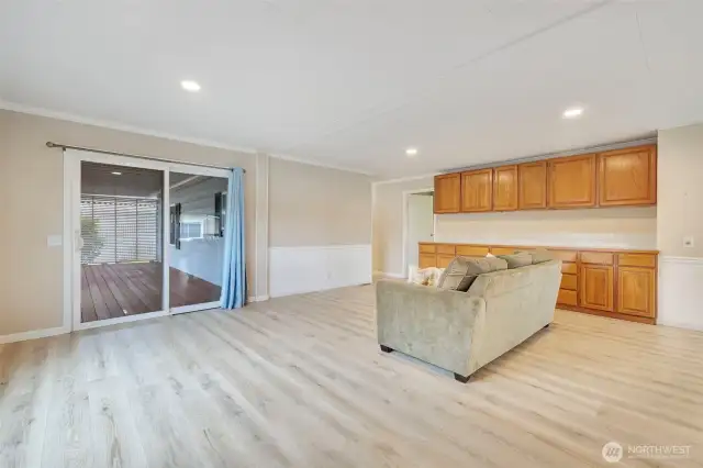 From the front door you enter into an open living space with access to the covered deck and  and cabinets for your storage needs.