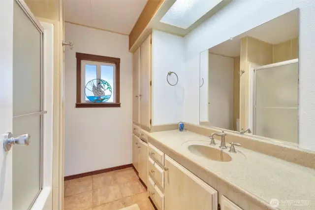 The hall bath has a low maintenance bathtub/shower and lots of room to move.