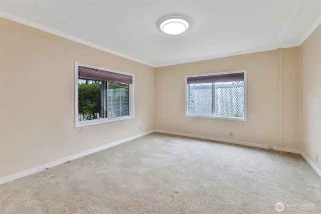Welcome to your oversized primary bedroom. A king size bed would easily fit.