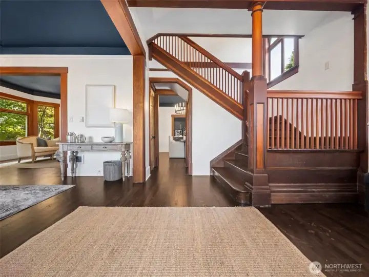 Grand entry with original gleaming hardwood floors refinished.