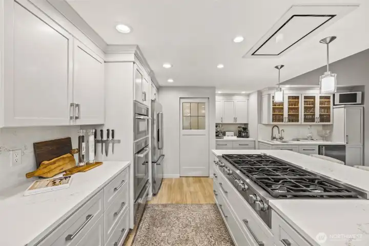 Behind the door is a walk-in pantry.