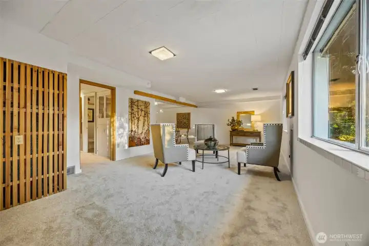 Large rec room that is big enough for a pool table, entertaining and it has a wet bar area around the corner.