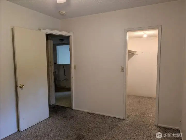 Primary bedroom with walk in closet. #2111 5th St SW, Puyllup, WA 98371
