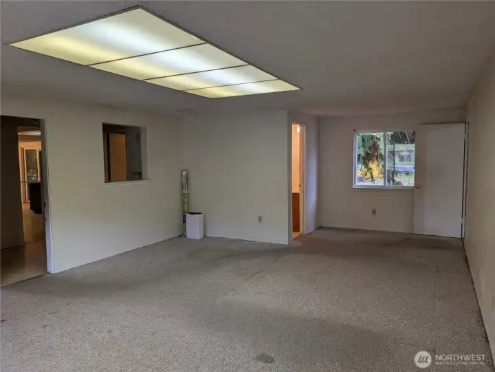 Large Rec room. This has been used as a primary or 4th bedroom with the 3/4 bath attached. #2111 5th St SW, Puyllup, WA 98371