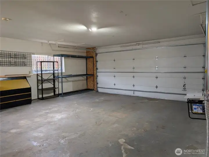 Large 2 car garage with oversized 18' door & tall ceilings. #2111 5th St SW, Puyllup, WA 98371