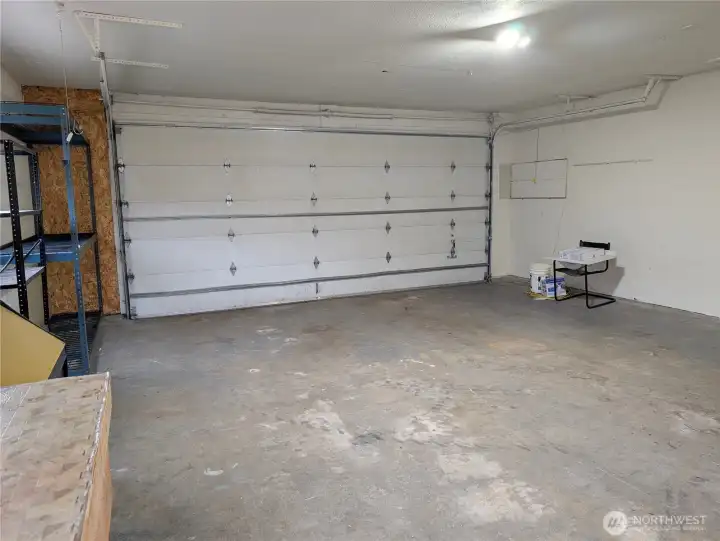 Large 2 car garage with oversized 18' door & tall ceilings. #2111 5th St SW, Puyllup, WA 98371