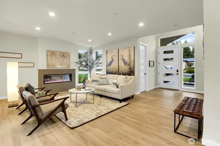 Spacious great room with electric fireplace, where you're met with a harmonious blend of style and function.