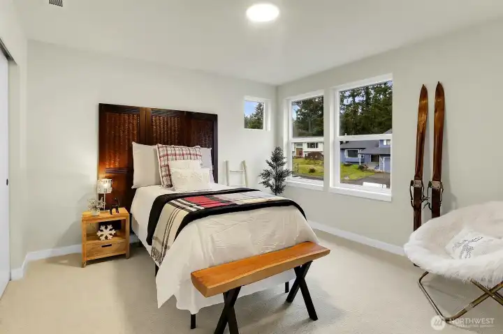Spacious and filled with natural light, the secondary bedrooms offer comfort and flexibility.