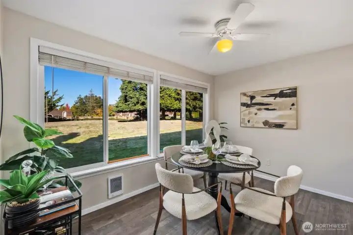 Expansive kitchen with large windows to take in the view of the expansive lawns and pool space.