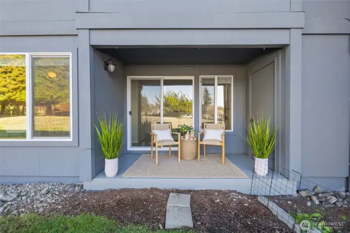 Private outdoor patio with views of the pool.