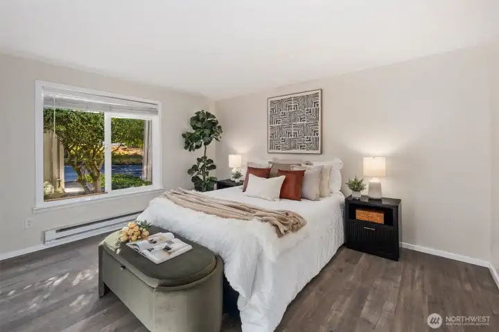 Open primary suite with walk in closet.