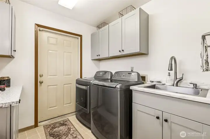 Laundry room with extra counter space and sink!