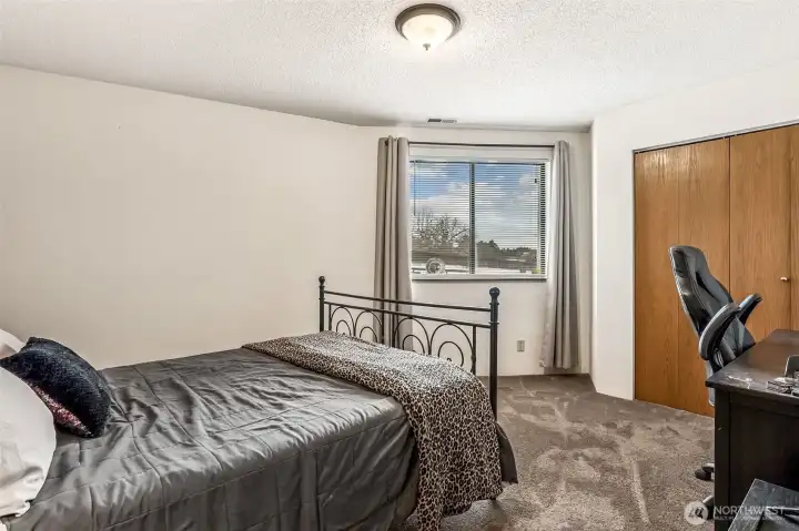 One of the downstairs bedrooms, notice the lake views through the window!