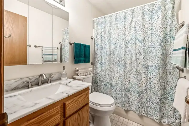 Downstairs bathroom with shower and bath tub