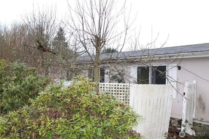 Back of home, partially fenced