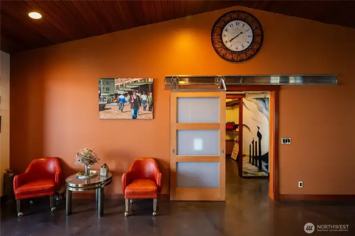 There is a lovely sitting area just adjacent to the primary suite just off the kitchen and dining areas.