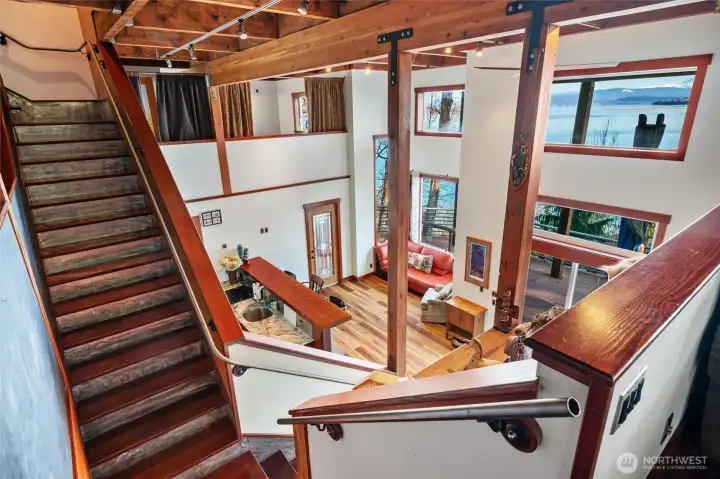 The wood stairway has brushed stainless kickplates and the old-growth fir timbers are absolutely stunning!