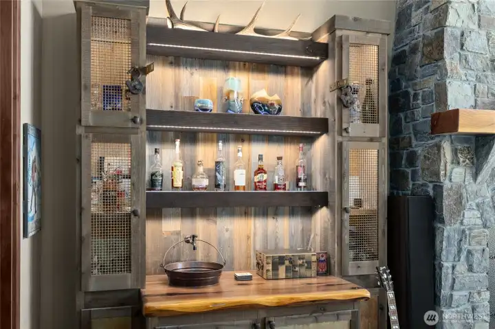 Custom wet bar with copper bucket sink