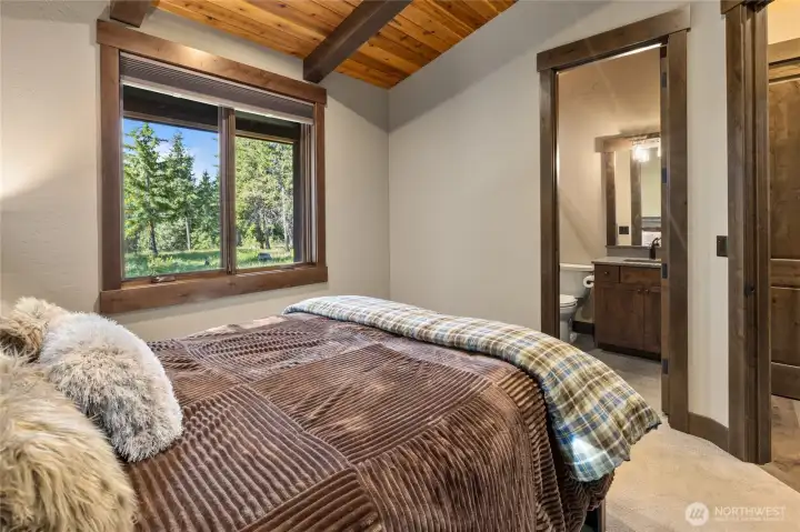 Primary bedroom in casita with bathroom and heated floors