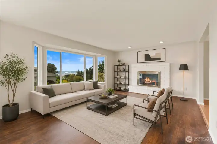 Living Room gets great light and has the warmth of wooden floor and fireplace