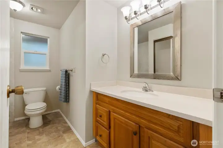 Full Bath with brand new tub and surround on Main floor off hallway