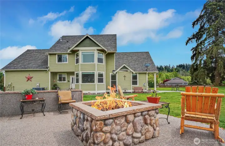 View from your backyard to the home, HUGE propane firepit on large patio for your gatherings day or night.