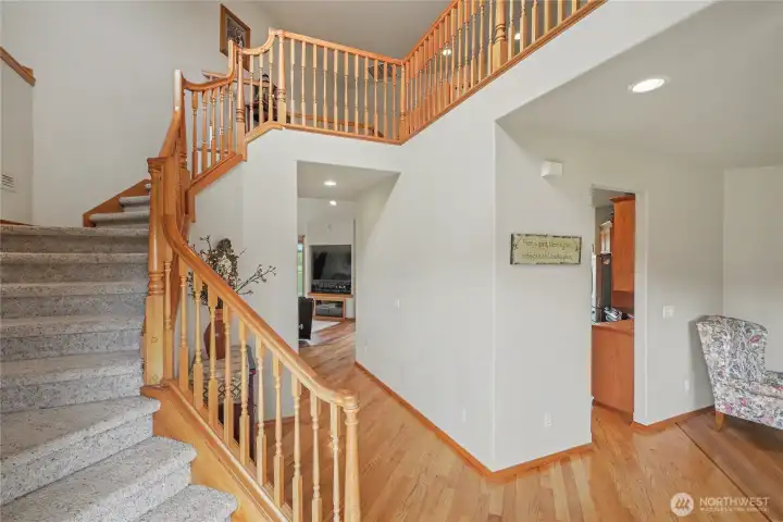 As you enter, you will find this dramatic staircase and 2-story entry, gorgeous hardwoods and quality construction and touches throughout.