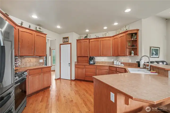 Kitchen view one, a chef's dream! Love the custom cabinetry with soft close, all the counter space and newer included appliances.