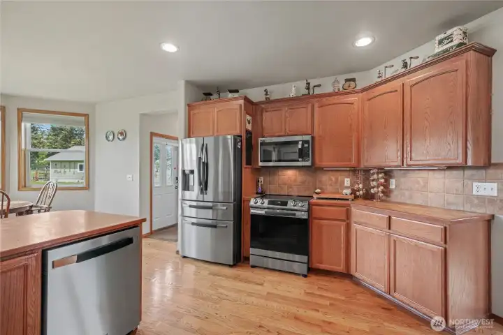 Kitchen view two, your back door to your upper left, hallway leads to utility room and garage as well.