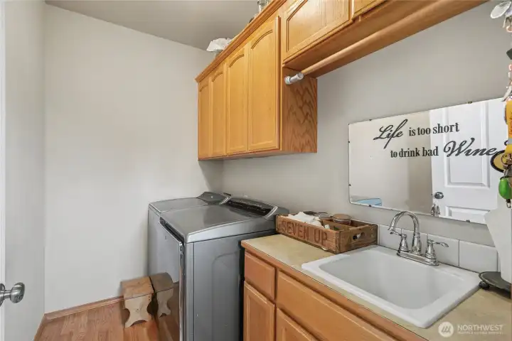 Utility room view, love the sink and all the cabinets!