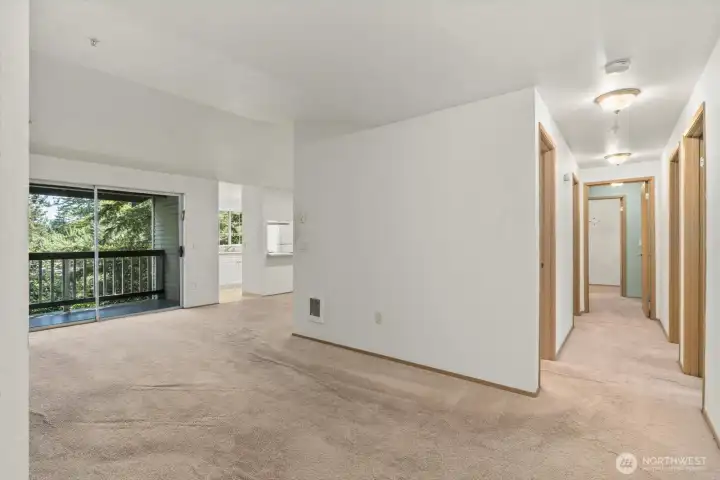 Seamless flow connects living, dining, and kitchen areas.