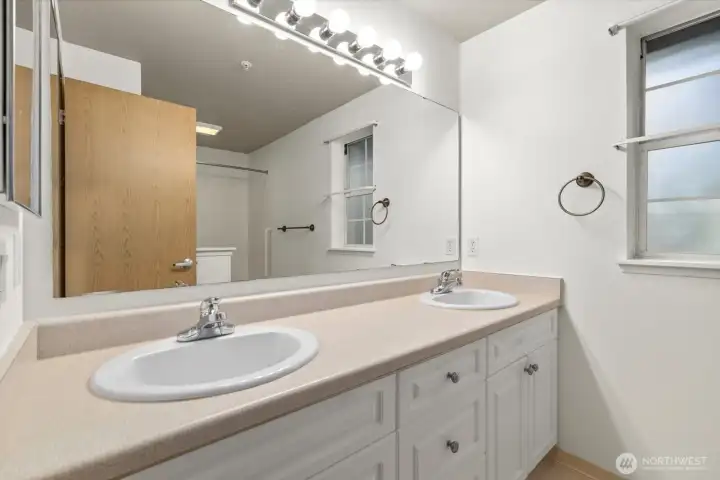 Private ensuite bath with dual sinks.