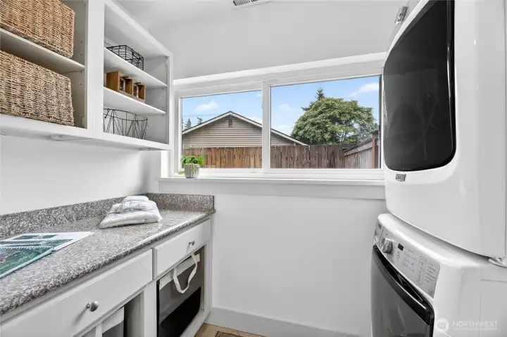 The laundry room is perfectly appointed near the kitchen for easy chore days