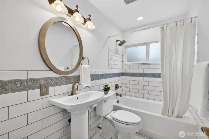 An updated full bath on the main floor to impress your guests