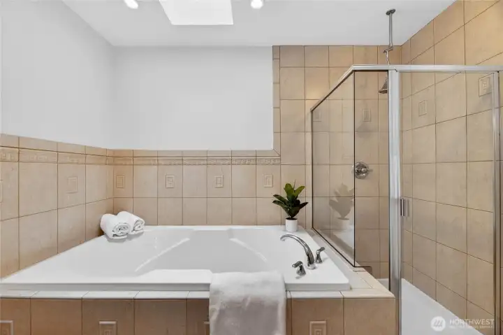 A large soaking tub rounds out this beautiful bathroom