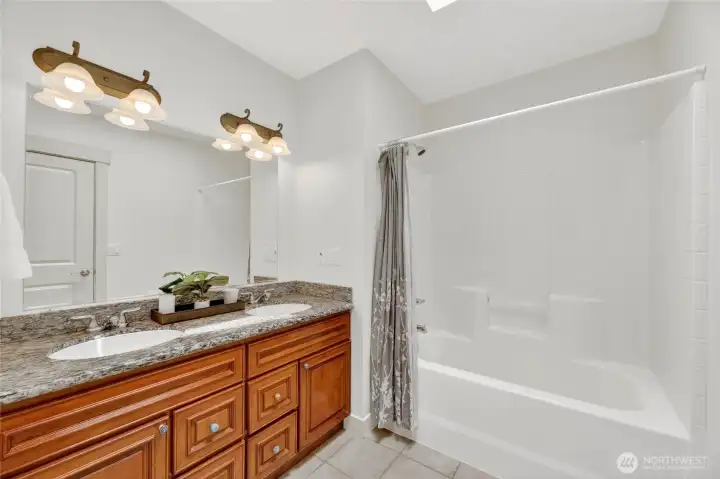 This bathroom has a pass through for the 2nd ensuite and the upstairs den for convenience