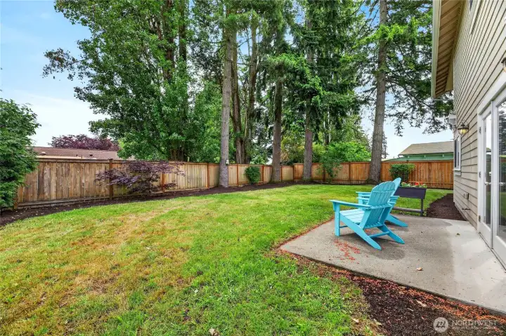 Look at this huge flat backyard ready for gardening and football games