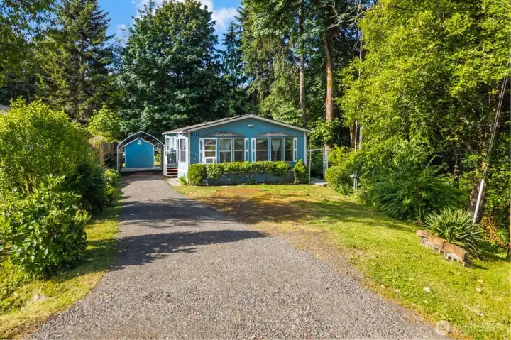 You feel the privacy before you even get to the front door, thanks to the long, freshly graveled drive leading you home.