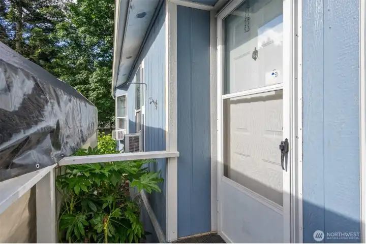 The front storm door is perfect for letting in that welcoming morning light while keeping the entry cozy and protected.