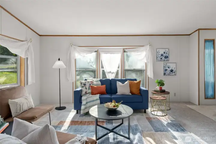 This bright living space has the kind of roomy layout that makes furniture placement feel easy. You have lot of options!
