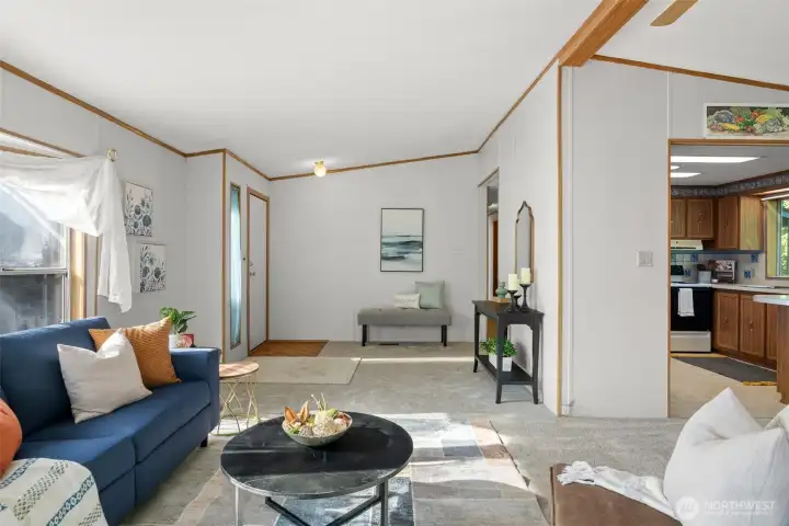 Just off the entry, the living room keeps everyone connected, with the kitchen close enough for easy conversation while meals are coming together.