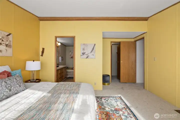 This primary bedroom is seriously roomy, and the ensuite bath and huge walk-in closet make it a dream come true!