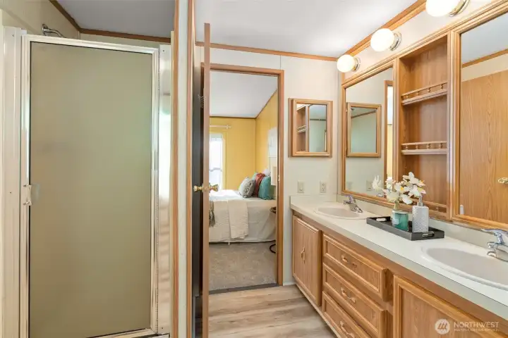 There’s a lot to appreciate in this primary bathroom, from the step-in shower and double mirrors to the big drawers that give you actual usable storage.