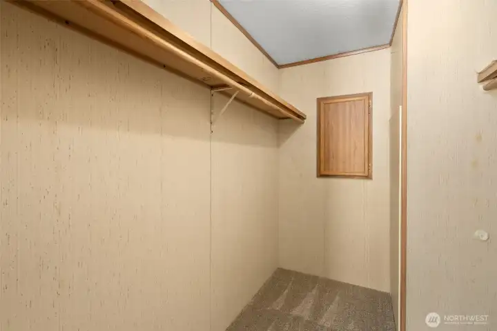 This walk-in closet is seriously awesome, with dual hanging rods on both sides so you have plenty of room to organize, store, and actually see what you have.