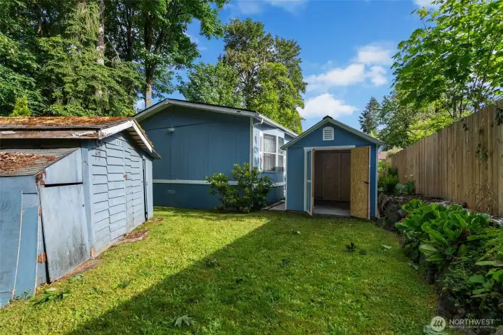 Storage bonus outside: two sheds, one with some history and one brand new, ready for tools, garden gear, and all the “where do we put this?” stuff.