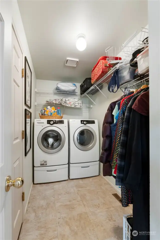 Washer and dryer stay! Door on left leads to the two-car garage.