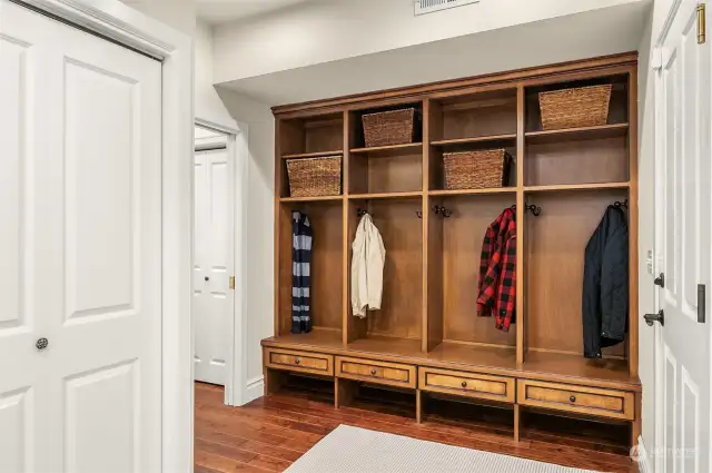 Mudroom complete with custom built-ins located next to the garage.