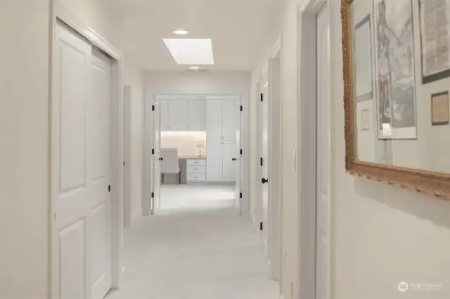 Step into a dreamlike hallway, freshly painted with new baseboards and luxurious, top-of-the-line carpeting that extends throughout the home.