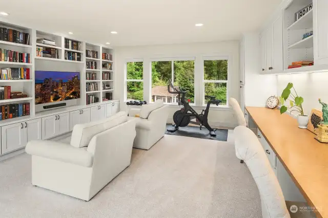 Discover the versatility of this expansive bonus room, complete with custom built-ins, ample space for movie nights, dedicated areas for studying, and plenty of room for workouts!
