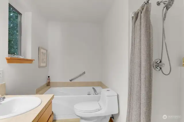 Luxury abounds, a soaking tub and separate shower in primary suite